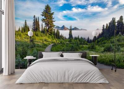 A trail at Mount Rainier national park leading through a forest with a layer of low fog Wall mural