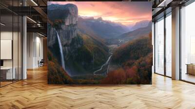 Epic autumn landscape with forest, trees, lake, waterfall and large rocky mountains. View from above. Wall mural