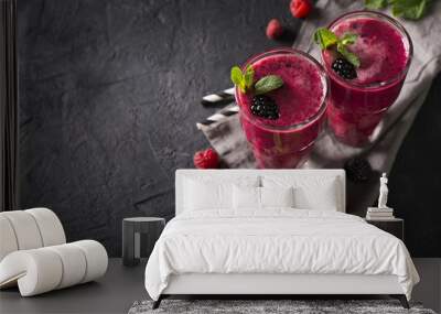 Blackberry and raspberry smoothies in glass with mint leaf and raw beeries Wall mural