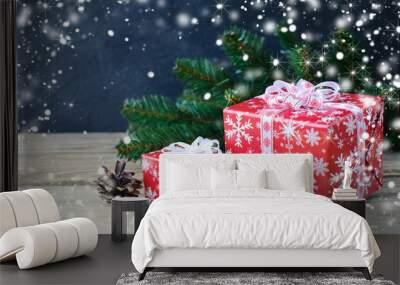 Christmas gifts with cinnamon and branch of pine on dark backgro Wall mural