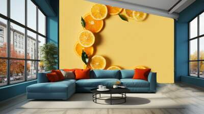 Citrus fruit food, orange and lemon shape of vitamin c flat lay on yellow background Wall mural