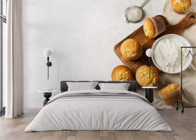 Homemade tasty miffins on white background Wall mural