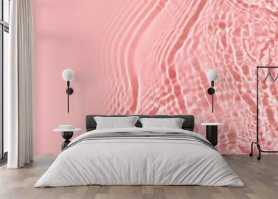 Transparent and clean pink water background with sunlight reflection Wall mural