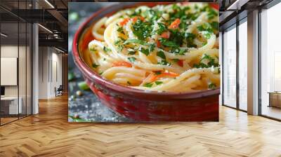  a red bowl brimming with creamy pasta and fresh green vegetables and carrot.  Wall mural