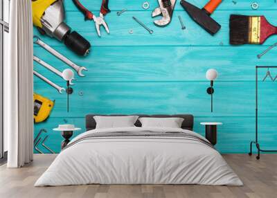 A set of construction tools on a wooden background. The concept of celebrating the father's day. Wall mural