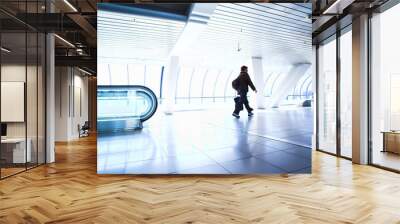 woman moving in corridor Wall mural