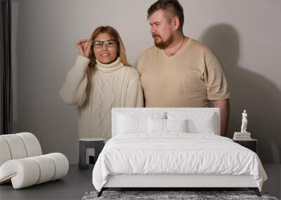 Man and woman on a gray background Wall mural