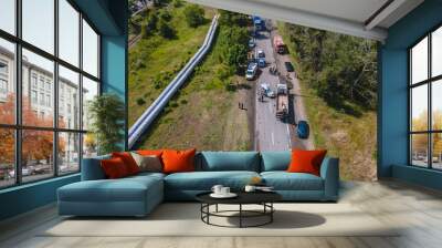 The truck and the car collided on the highway. Strong accident. Traffic accidents on the road. View from above. Traffic jam on the road. Wall mural