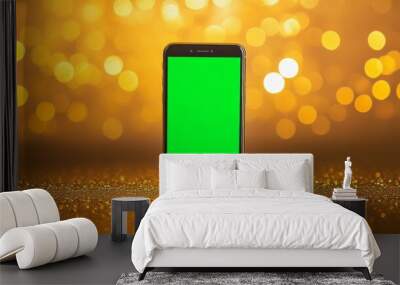 Close-up mock up of the smartphone with green screen or chroma key, mobile phone on the Golden bokeh background Wall mural