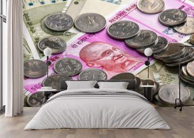 Close up view of brand new indian 2000 rupees banknote and coins. 500 rupee banknotes in background. Wall mural