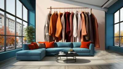 Clothes hanging in row. Many clothes for autumn or fall season.  Wall mural