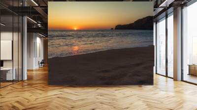 Sunset on the beach at Nazare, Portugal. Wall mural