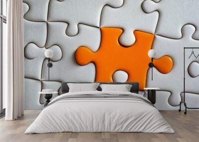 Picture of an orange puzzle piece that fits into a white puzzle. Teamwork, solutions, and problem-solving concepts are emphasized Wall mural