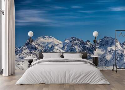 Snowy peaks against the blue sky Wall mural