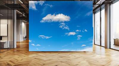 Blue sky with white beautiful clouds as an abstract background. Wall mural