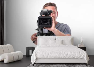 Cameraman. Video camera operator isolated on a white background. Wall mural