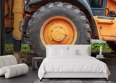 Close-up of a construction tractor wheel. Wall mural