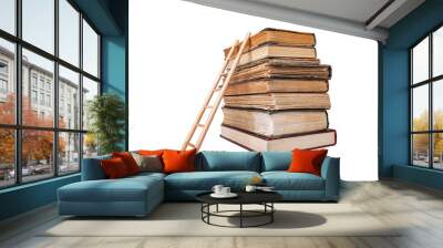 Stack of old books and wooden ladder isolated on white background. Wall mural