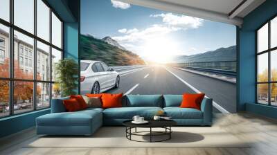 White car on a scenic road. Car on the road surrounded by a magnificent natural landscape. Wall mural