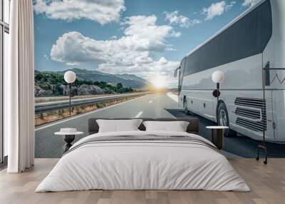 white passenger bus on the highway against the backdrop of a beautiful landscape. Wall mural