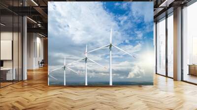 Wind power plants on the background of the cloudy sky. Wall mural