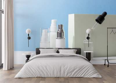 Set of white cosmetic bottles and jars with hard shadows. Beauty salon concept. Wall mural