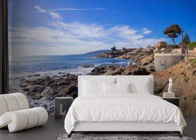 beautiful rocky coast, azure water and blue sky in Sunny weather in Saint Aygulf, France Wall mural