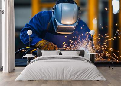 Welder fusing metal pieces with sparks and protective gear Wall mural