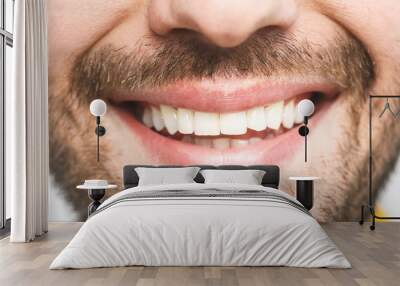 Detailed image of young man smiling with perfect white teeth. Healthy concept. Close-up. Wall mural