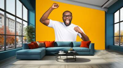 Portrait of excited young African American male screaming in shock and amazement. Surprised man looking impressed, can't believe his own luck and success Wall mural