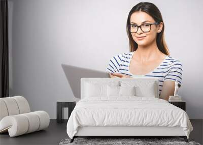 portrait of happy wow young beautiful surprised woman standing with laptop isolated on white backgro Wall mural