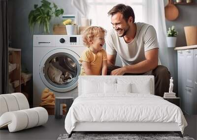 happy family father and his kid doing laundry together at home Wall mural