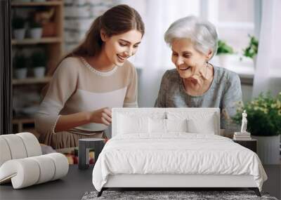 Happy old mother and her daughter preparing healthy food in the kitchen at home Wall mural