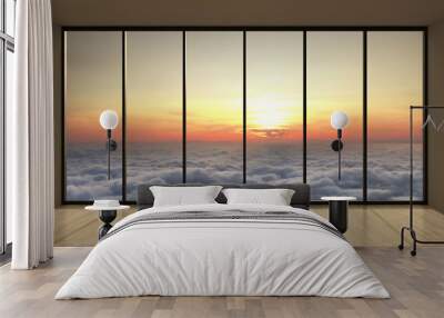 View through panoramic window sunset and clouds Wall mural