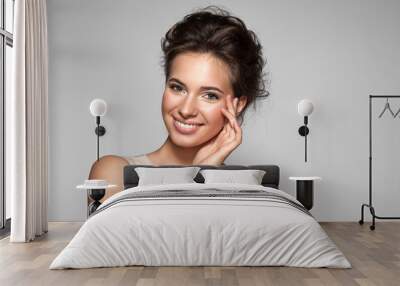 Portrait of young woman with perfect skin clean with natural make-up Wall mural