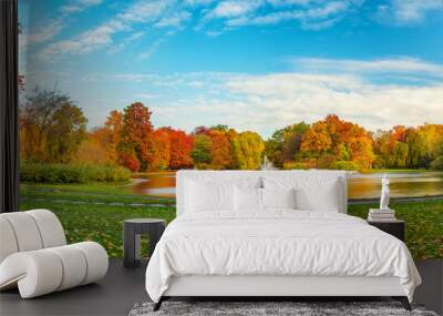 beautiful fall landscape and cloudy sky. autumn panorama - yellowed trees in city park in cloudy wea Wall mural