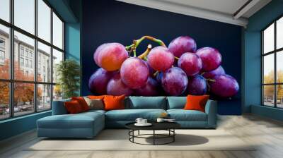 bunch of ripe grapes on a black background Wall mural