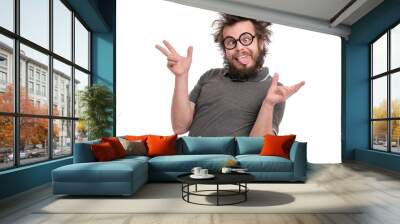 crazy bearded man with funny haircut in eye glasses making grimace - funny face. casual silly guy, i Wall mural