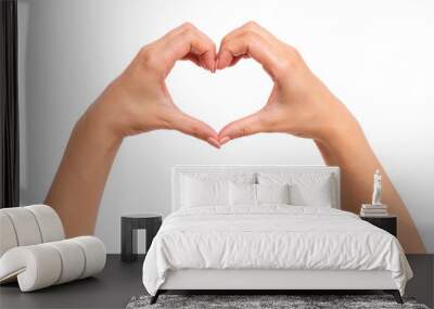 Female hands making sign Heart by fingers, isolated on white background. Beautiful hands of woman with copy space. Love concept on Valentine day. Wall mural