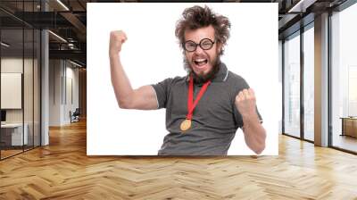 Happy winner. Crazy bearded Man with funny Haircut in eye Glasses celebrating success. Cheerful Guy with gold Medal, screaming and keeping mouth open, isolated on white background. Wall mural