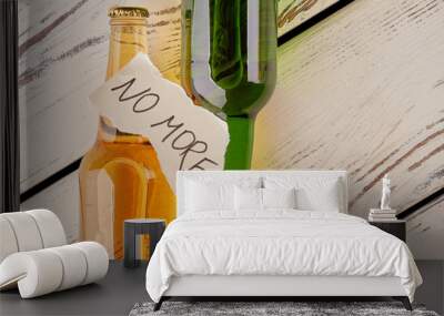 Alcohol abuse, how to stop. Full bottles of alcohol beverages, torn papers sheet with text, old floor. Ways to beat booze. Wall mural