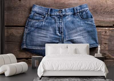 denim shorts on aged shelf. Wall mural