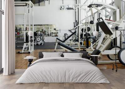 Modern gym interior with equipment. New modern gym or fitness club with sport equipment. Wall mural