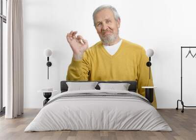 Portrait of old grandpa making ok gesture. White isolated background. Wall mural