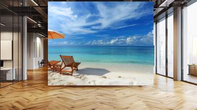 Beach chairs and umbrella on a sunny tropical beach. Two wooden lounge chairs under a white umbrella on a pristine beach with turquoise water and a bright blue sky Wall mural