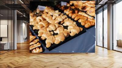 Baked goods like pretzels and croissants as part of a buffet at a wedding reception Wall mural