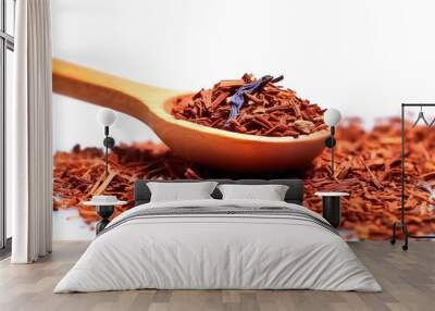 Heap of dry rooibos tea leaves with wooden scoop, closeup view Wall mural