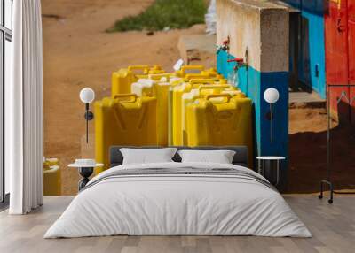 Water cans in Uganda, Africa Wall mural