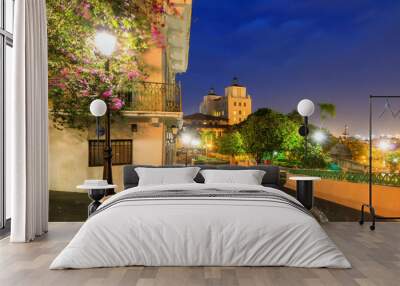 Beautiful summer cityscape of old San Juan, Puerto Rico, at the blue hour at night Wall mural