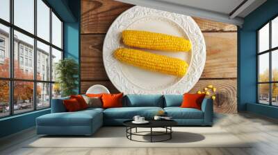 two corn cobs on a plate with salt. Wall mural